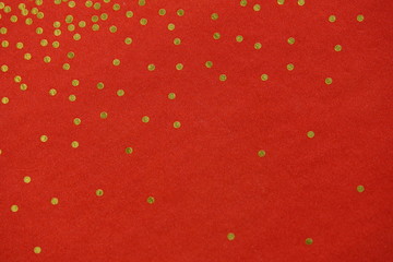 gold dots on red background