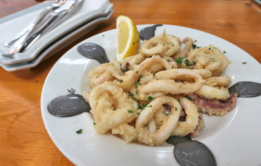 Fried breaded calamari dish in a restaurant of Menorca.