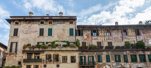 Old house with frescoes on the walls Case dei Mazzanti on Piazza Erbe in Verona, Italy
