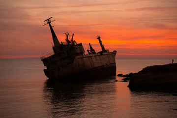 Beautiful seascape and shipwreck. Abandoned ship Edro III at sunset near the Paphos, Cyprus.