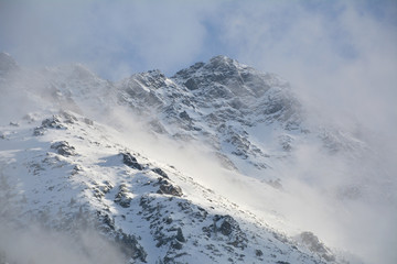 Fototapeta na wymiar Tatra mountains emerge from the clouds.