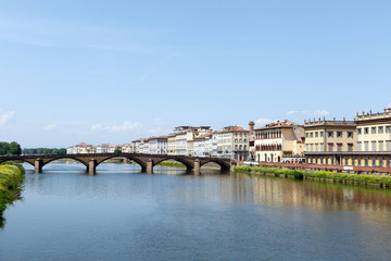 Bridge across the Arno River, Florence, Italy with palazzos lining the bank
