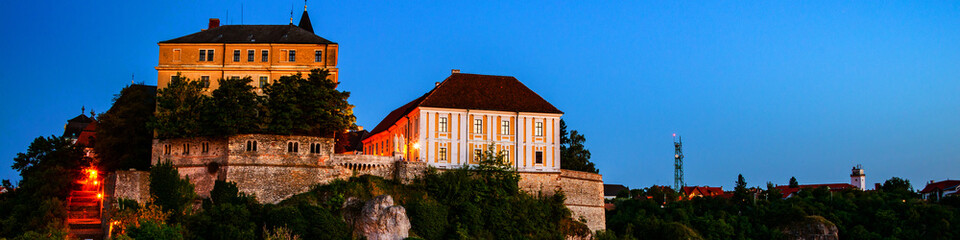 Fototapeta na wymiar View of illuminated landmarks of Castle hill at night in Veszprem, Hungary