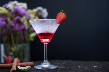 Strawberry martini drink on wooden 