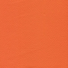 Orange leather textured background. Vintage fashion background for designers and composing collages. Luxury textured genuine leather of high quality.