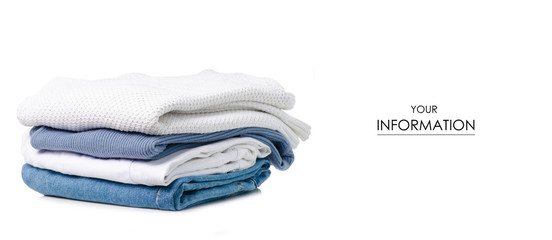 Stack of clothing jeans sweaters pattern on a white background isolation