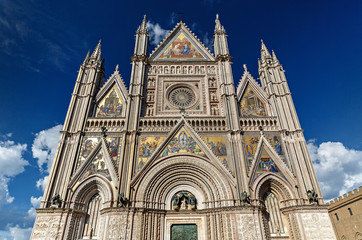 Fototapeta na wymiar Exterior view of Duomo di Orvieto, a 14th-century Gothic cathedral in Orvieto, Italy, photo without people
