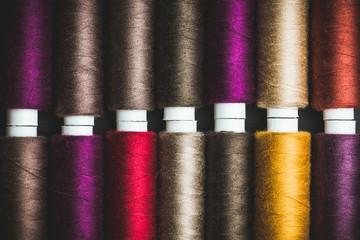 Color sewing threads close-up shot. Selective focus. Shallow depth of field.