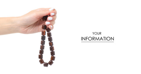 Wooden rosary in hand pattern on white background isolation