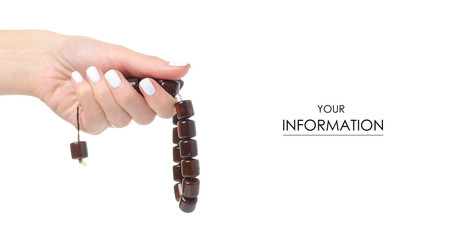 Wooden rosary in hand pattern on white background isolation