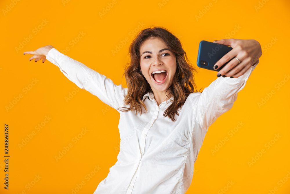 Sticker Portrait of a cheerful young woman wearing white shirt