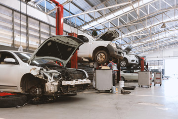 closeup car in repair station and body shop with soft-focus and over light in the background