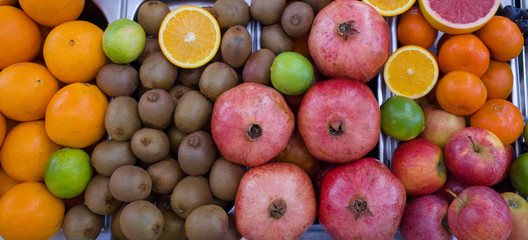 Shelf with ripe fruits. Assorted for fresh juices. Farmer's market.