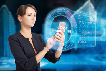 The concept of business, technology, the Internet and the network. A young entrepreneur working on a virtual screen of the future and sees the inscription: Video marketing