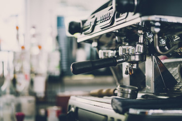 Barista white costume make coffee latte art with espresso coffee machine in cafe restaurant vintage  image color tone