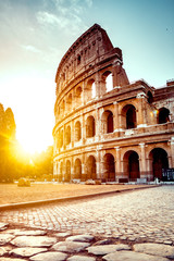 The ancient Colosseum in Rome at sunset