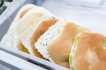 Sale of bread and cheese at the foot of the San Pedro market in Cusco - Peru.
