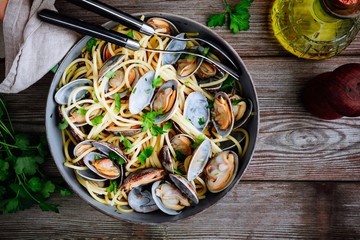 Traditional italian seafood pasta with clams Spaghetti alle Vongole in the pan