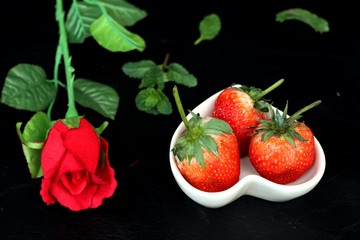 fresh red strawberry on black