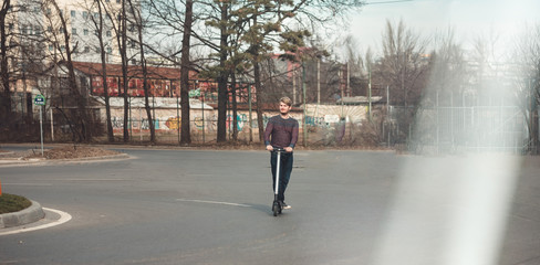 Micro mobility riding electric scooter for outdoor personal transportation ecologic alternative e-scooter, personal electric vehicle kickscooter future urban transport technology for smart city © Damian