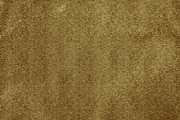 Luxury gold textile background. Silk cloth texture. Fabric pattern.