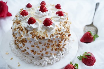 Homemade White forest cake with strawberries and granola topping