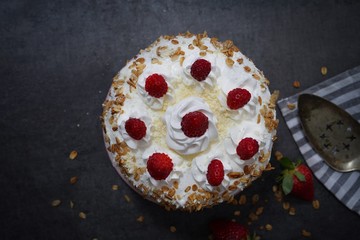 Homemade White forest cake with strawberries and granola topping