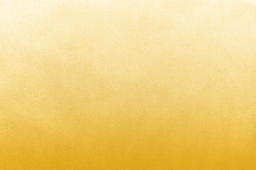 Luxury gold textile background. Silk cloth texture. Fabric pattern.