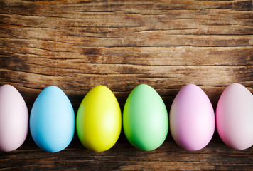 Easter eggs decoration on wooden background.