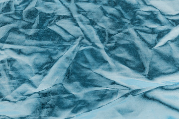 Ocean blue textile background. Silk cloth texture. Fabric pattern.
