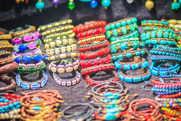 Colorful bracelets, beads and necklaces souvenir for sale on street at Khao San Road night market,...