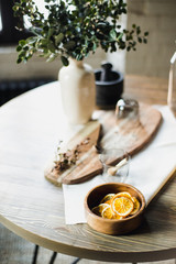 still life kitchen table, wooden board, vase