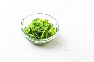 Wakame seaweed salad with sesame seed. Traditional Japanese food.