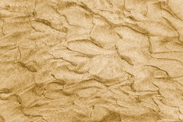Texture of sand under crystal clear water