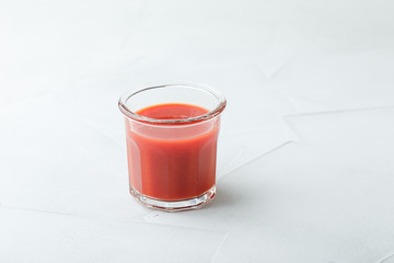 Glass of fresh organic tomato juice