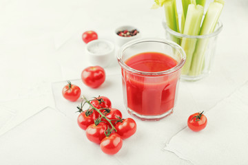 Glass of tomato juice and celery stems