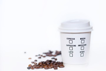 Paper coffee cup take away with coffee beans isolated on white background
