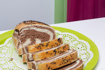Freshly ruddy bread. The slice shows cocoa blotches.