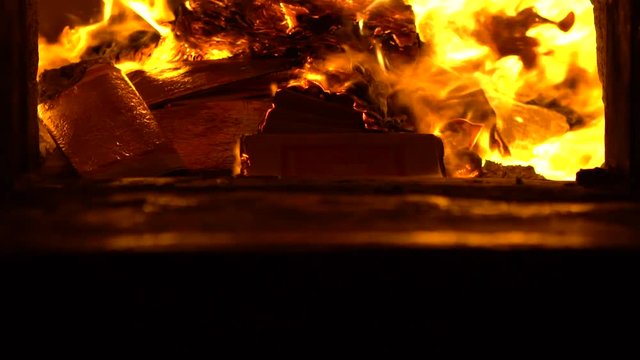 Slow Motion of people burning joss paper in ancient asian temple Taiwan. Burn the ghost money is a tradition in honor of the ancestors for the spirit of the deceased has good things in afterlife-Dan
