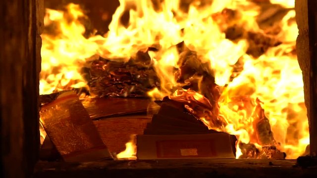 People burning joss paper in ancient asian temple Taiwan. Temples are a place of worship. Taiwanese folk religion for make wish. People praying buddha with incenses sticks-Dan