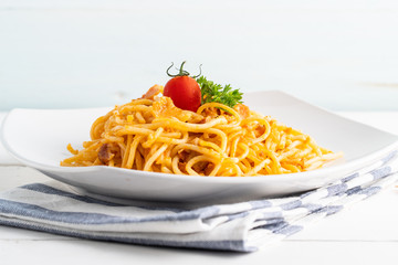 Spaghetti in white plate.
