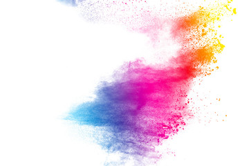 Abstract multi color powder explosion on white background.  Freeze motion of  dust  particles splashing. Painted Holi in festival.