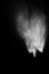 Fototapeta na wymiar White talcume powder explosion on black background. White dust splashing.