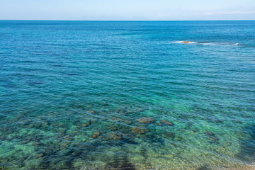 Fototapeta na wymiar Turquoise Blue Mediterranean Sea along the Southern Italian Coast