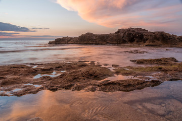 Long Exposure of the Mediterranean Sea Coast in Southern Italy at Sunset