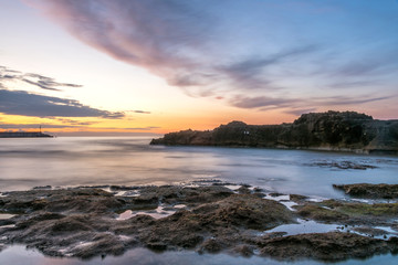 Long Exposure of the Mediterranean Sea Coast in Southern Italy at Sunset