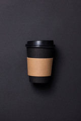 Black coffee cup with blank brown label