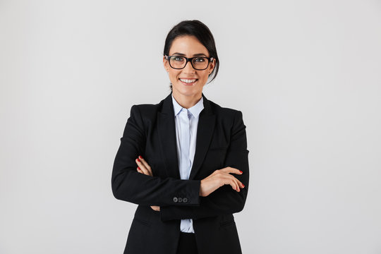 Portrait Of Successful Businesswoman 30s In Formal Wear And Eyeglasses Standing In The Office, Isolated Over White Background