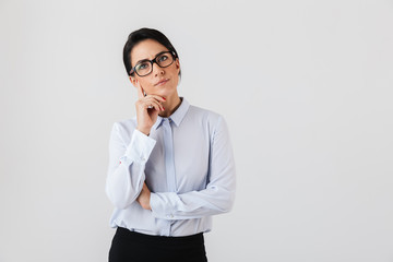 Image of caucasian secretary woman wearing eyeglasses standing in the office, isolated over white...