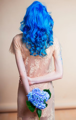 blue hair hairstyle curls girl's back bright hair color creative painting in a bright shade colorist work summer style